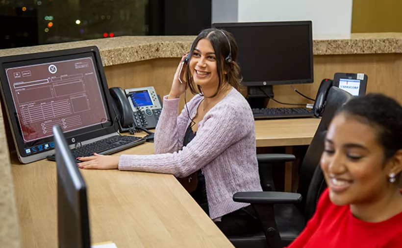 Servcorp receptionist answering and transferring calls professionally.