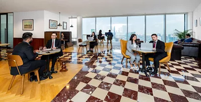 The elegant and collaborative interior of Servcorp at Emirates Towers, Dubai. With floor-to-ceiling windows offering panoramic views.