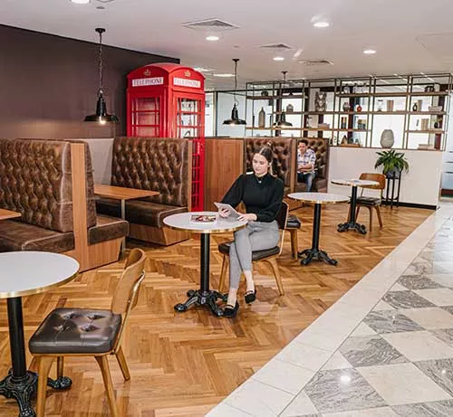 Modern coworking space at Servcorp with a client working