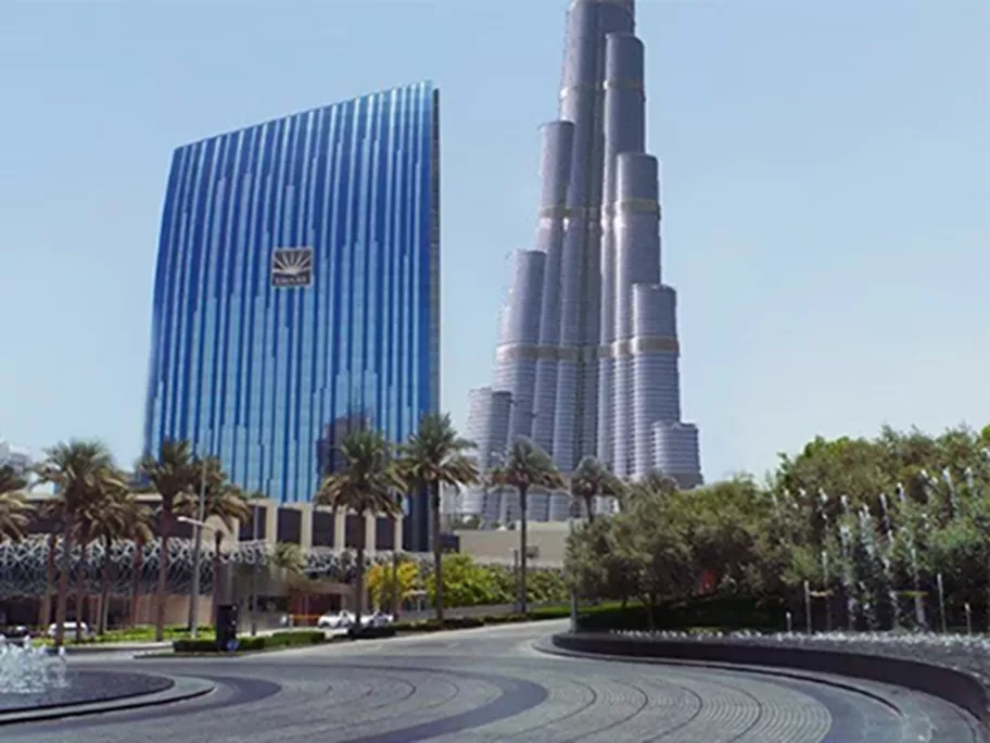 This image captures the stunning Boulevard Plaza alongside the iconic Burj Khalifa in Downtown Dubai, Boulevard Plaza