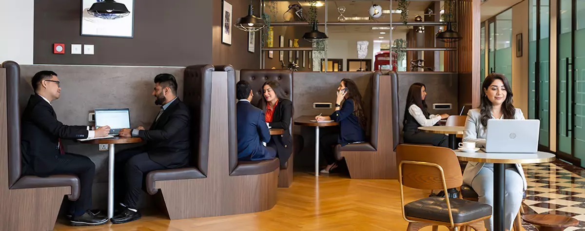 Clients blending comfort with productivity in Servcorp’s stylish booth seating in Emirates Towers, Dubai