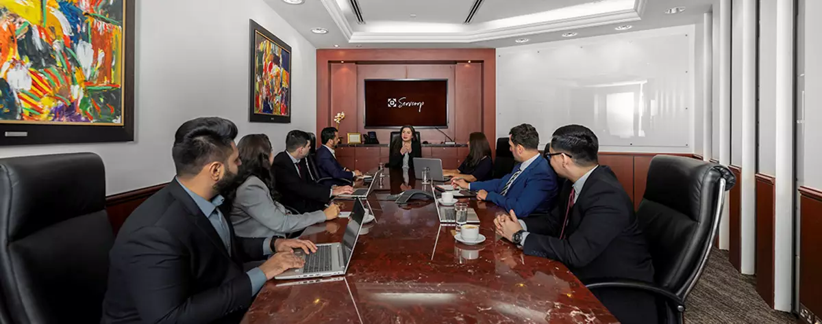 Fully equipped boardrooms in Emirates Towers, Dubai, were people are having a meeting 