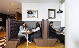 Polished and professional coworking environment at Servcorp Emirates Towers, Dubai, were people are working 